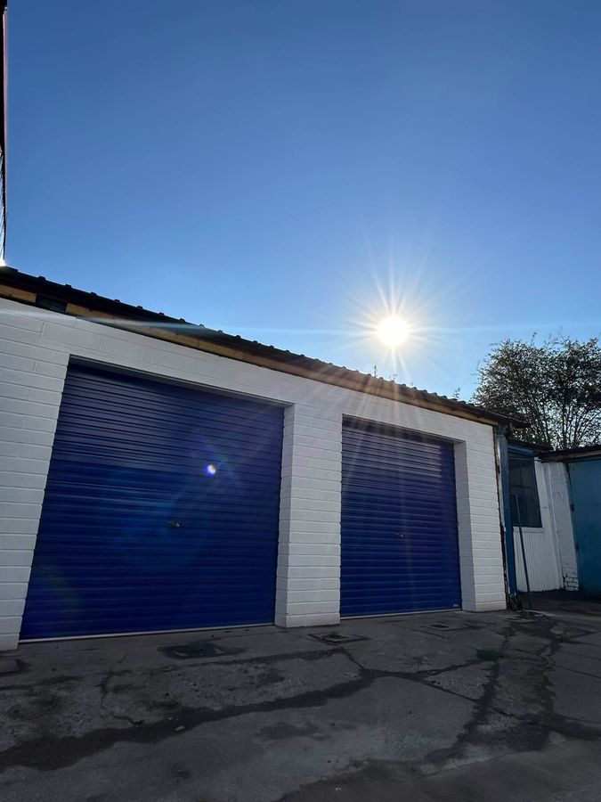 Secure blue roller shutter doors on the units